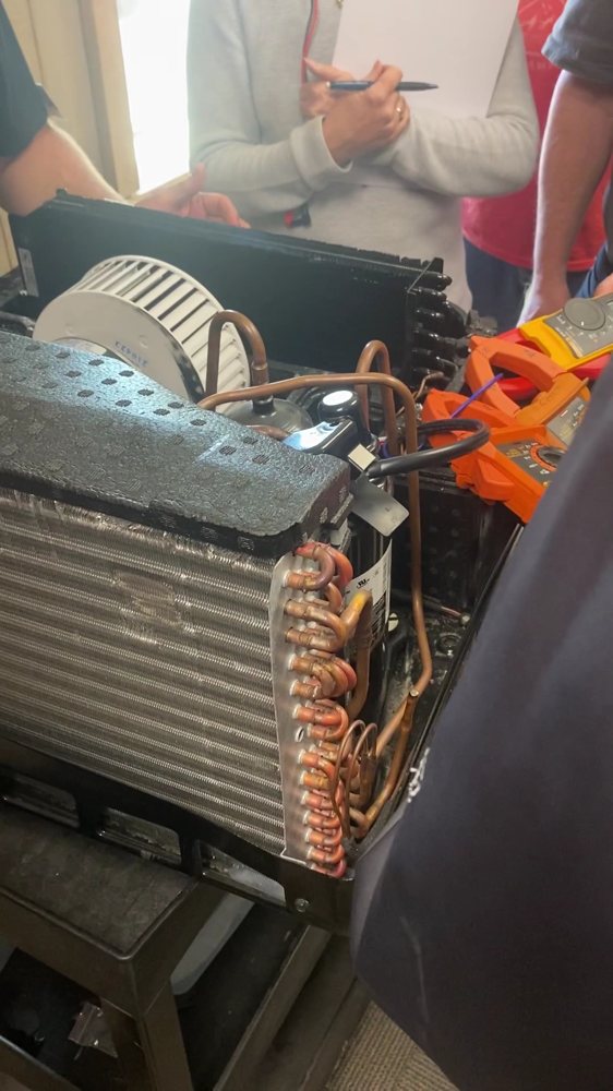 Rooftop AC unit opened up during a repair