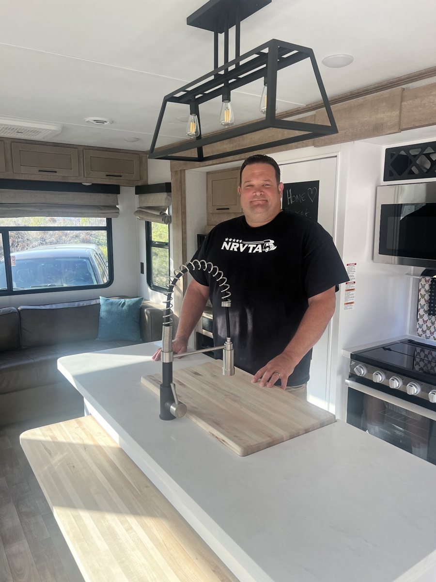 Josh Holt inside a customer's RV in Arkansas City